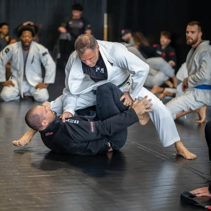 Coaching a live Brazilian Jiu-Jitsu class on the mat